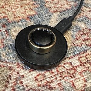 Oura Gold Ring Gen 3 with charging dock- erased and ready to pair